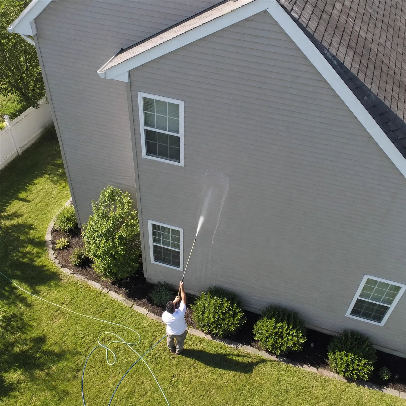 Low-pressure soft washing applied to a Charlotte roof and siding