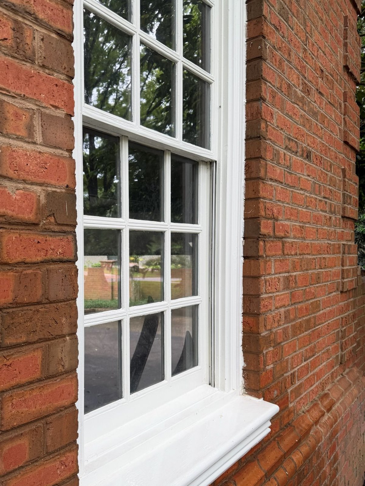 The same window after cleaning — clear, streak-free glass